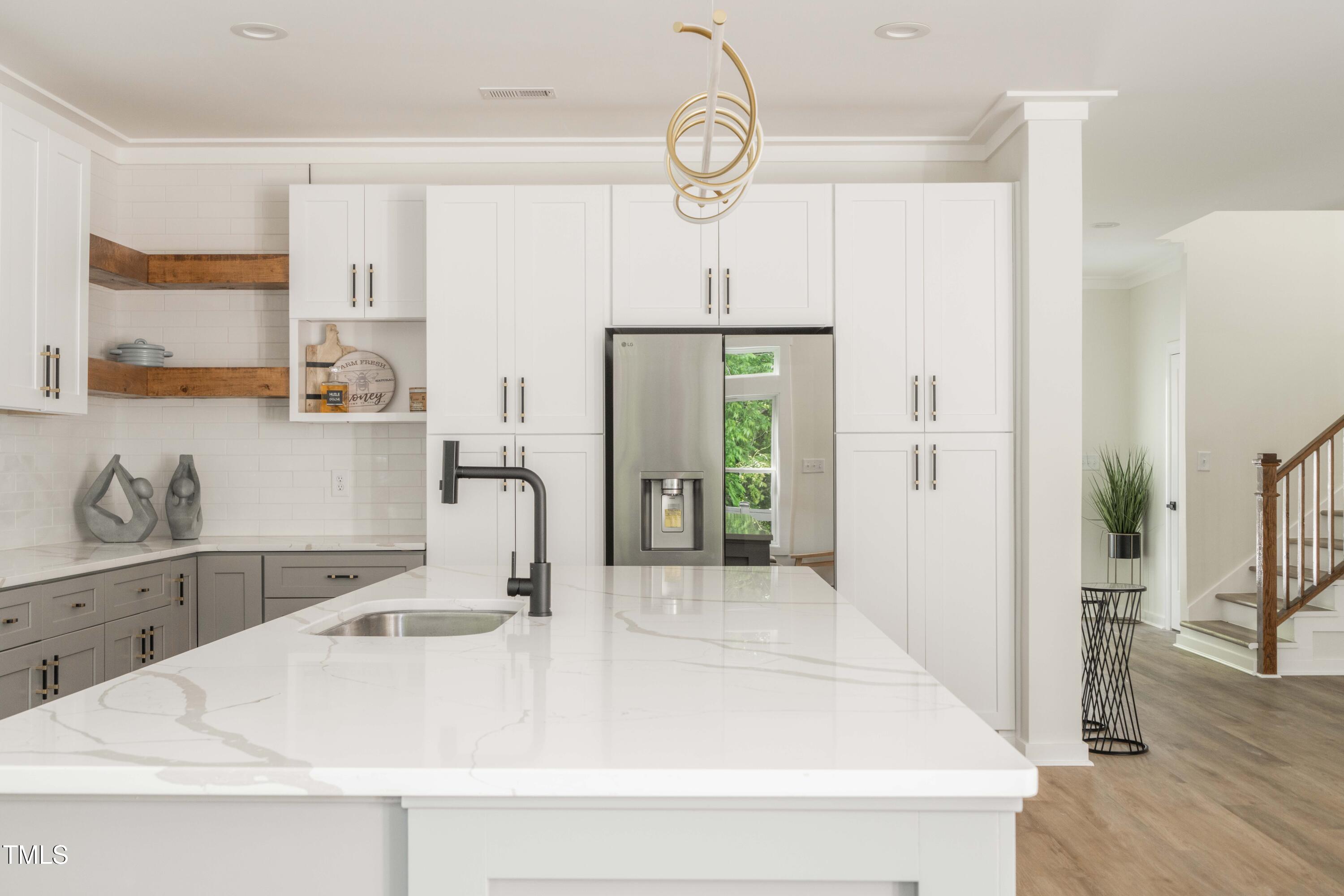 1124 Upchurch Street Raleigh, NC 27610 - Photo 13 of 45 a bathroom with a sink a vanity and a mirror