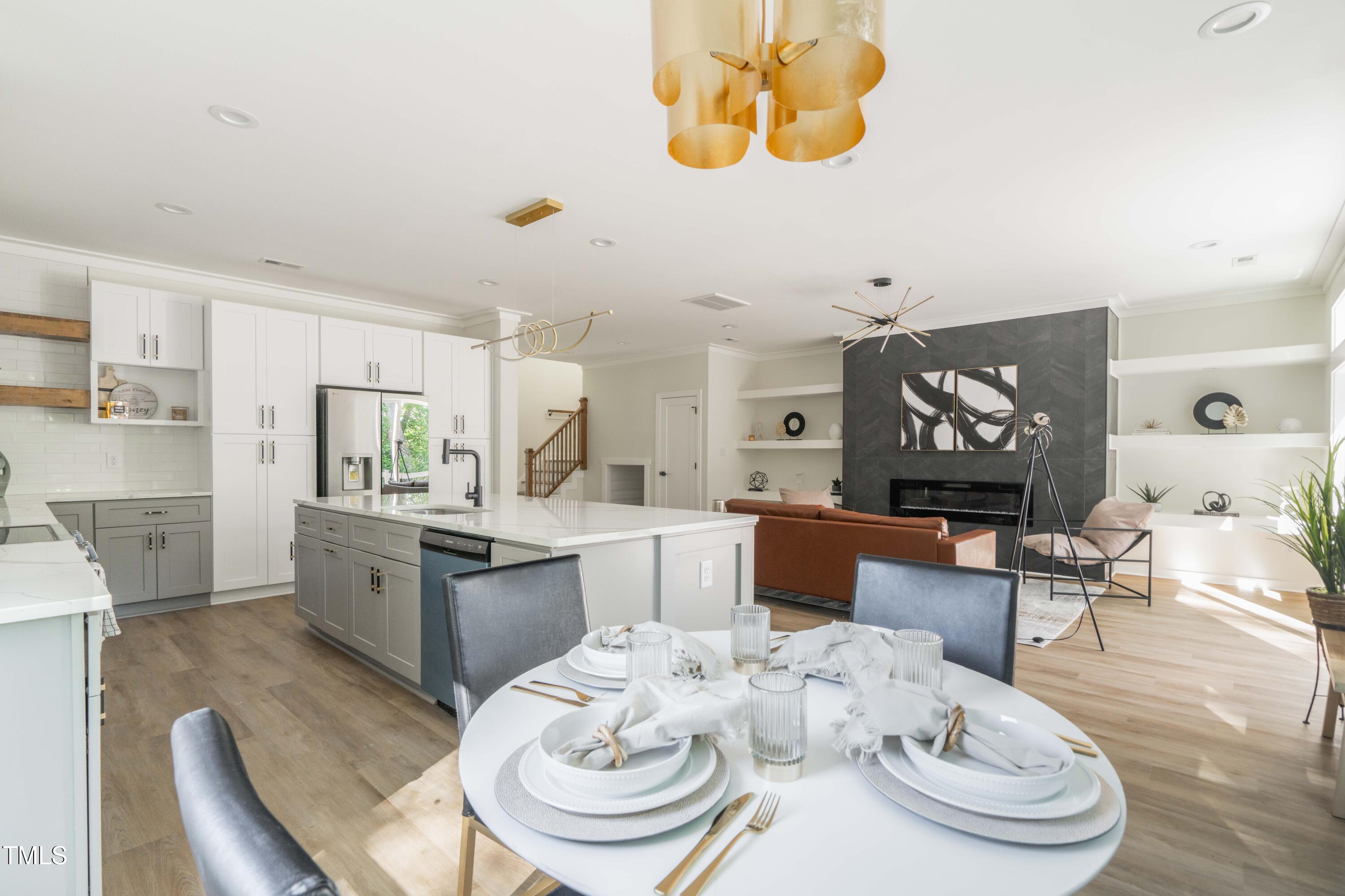 1124 Upchurch Street Raleigh, NC 27610 - Photo 15 of 45 a large kitchen with a table and chairs in it