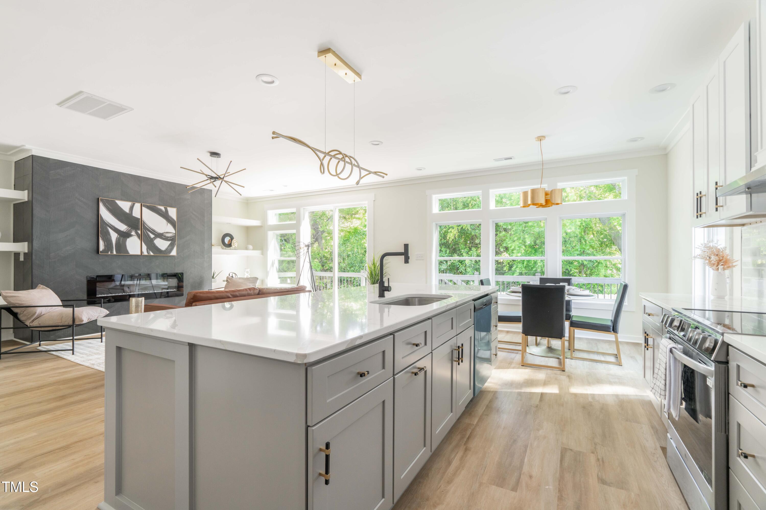 1124 Upchurch Street Raleigh, NC 27610 - Photo 17 of 45 a kitchen with counter top space a sink and appliances
