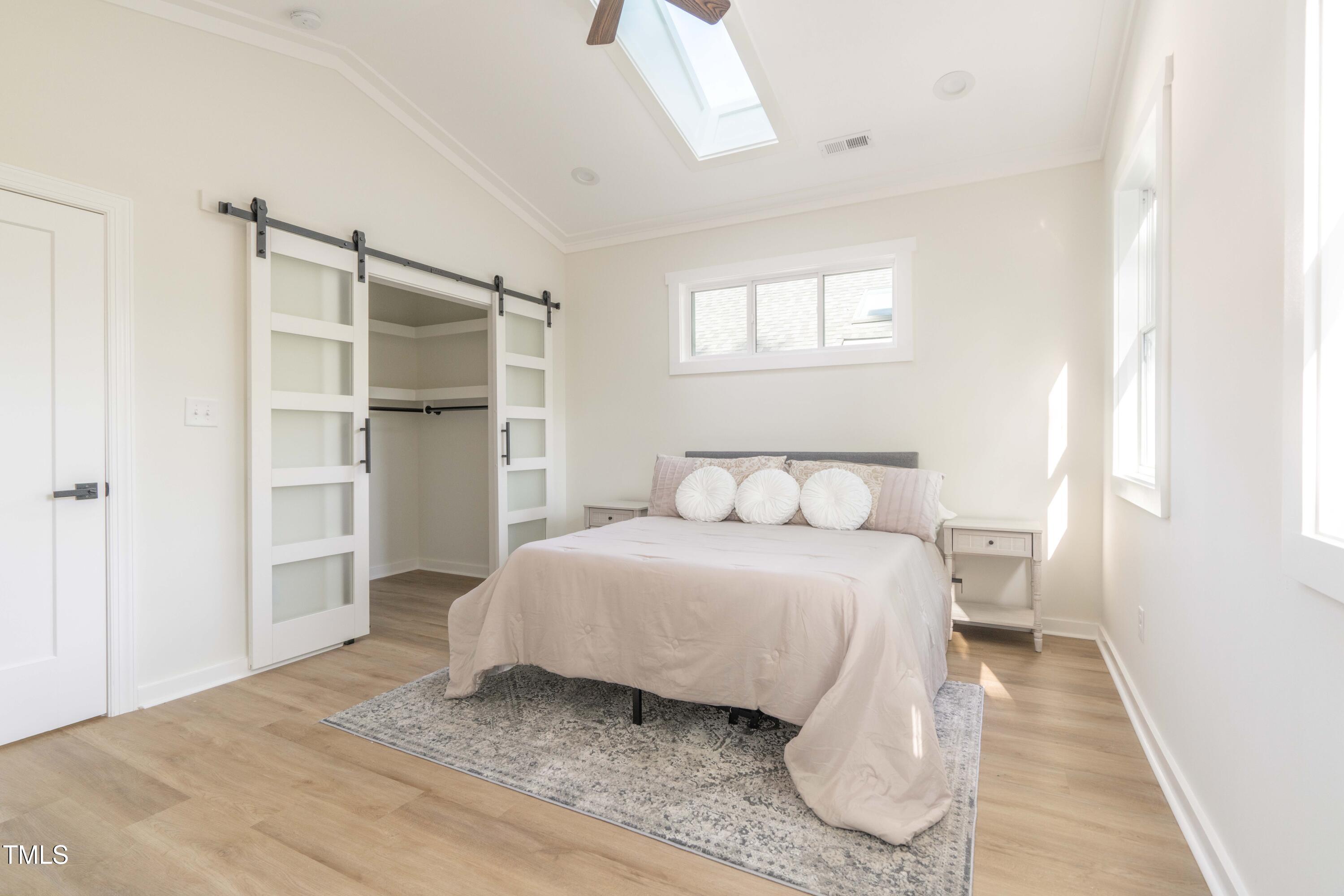 1124 Upchurch Street Raleigh, NC 27610 - Photo 24 of 45 a bedroom with a bed and a window