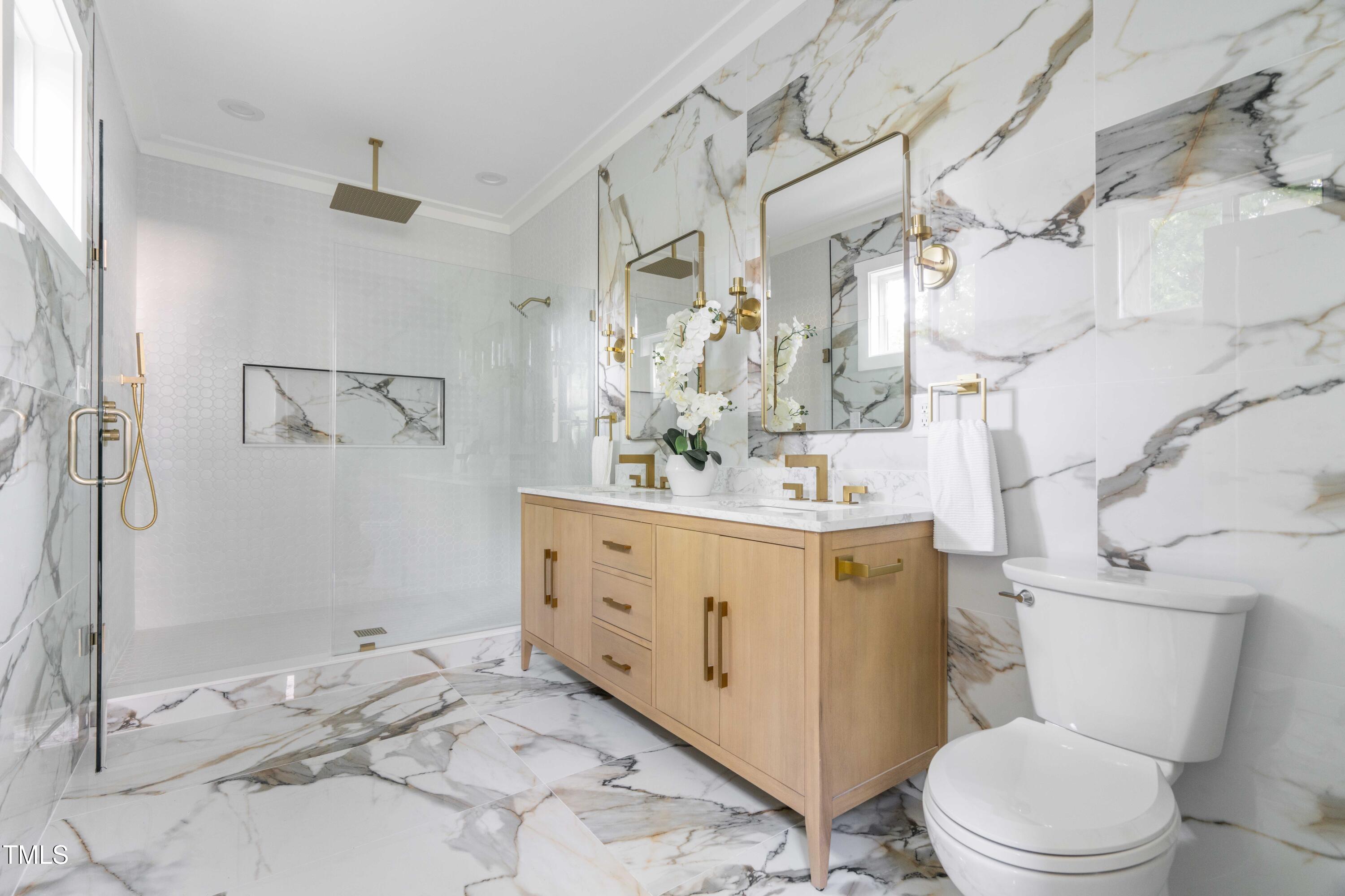 1124 Upchurch Street Raleigh, NC 27610 - Photo 25 of 45 a bathroom with a sink toilet vanity and shower