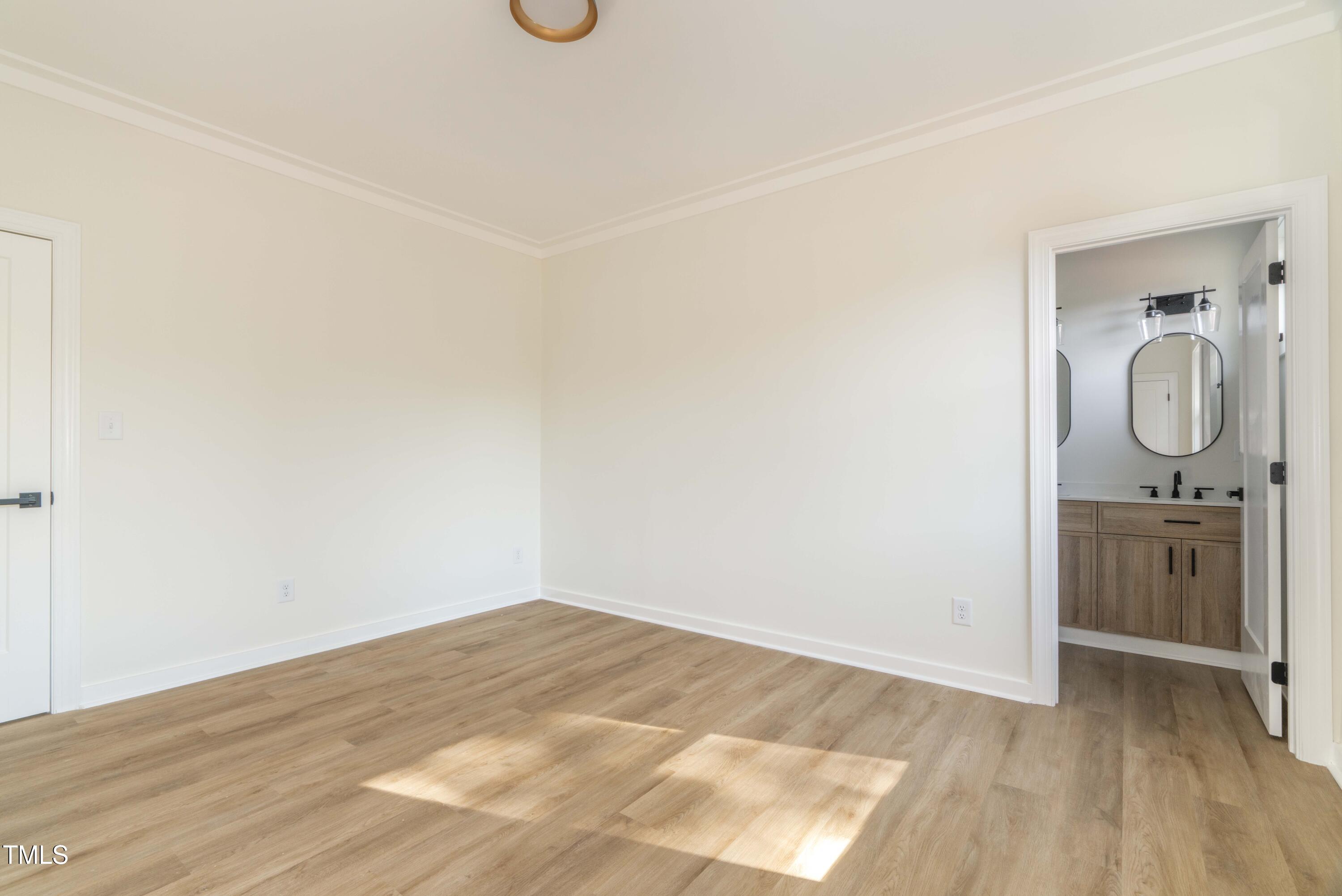 1124 Upchurch Street Raleigh, NC 27610 - Photo 30 of 45 a view of a storage & utility room with wooden floor