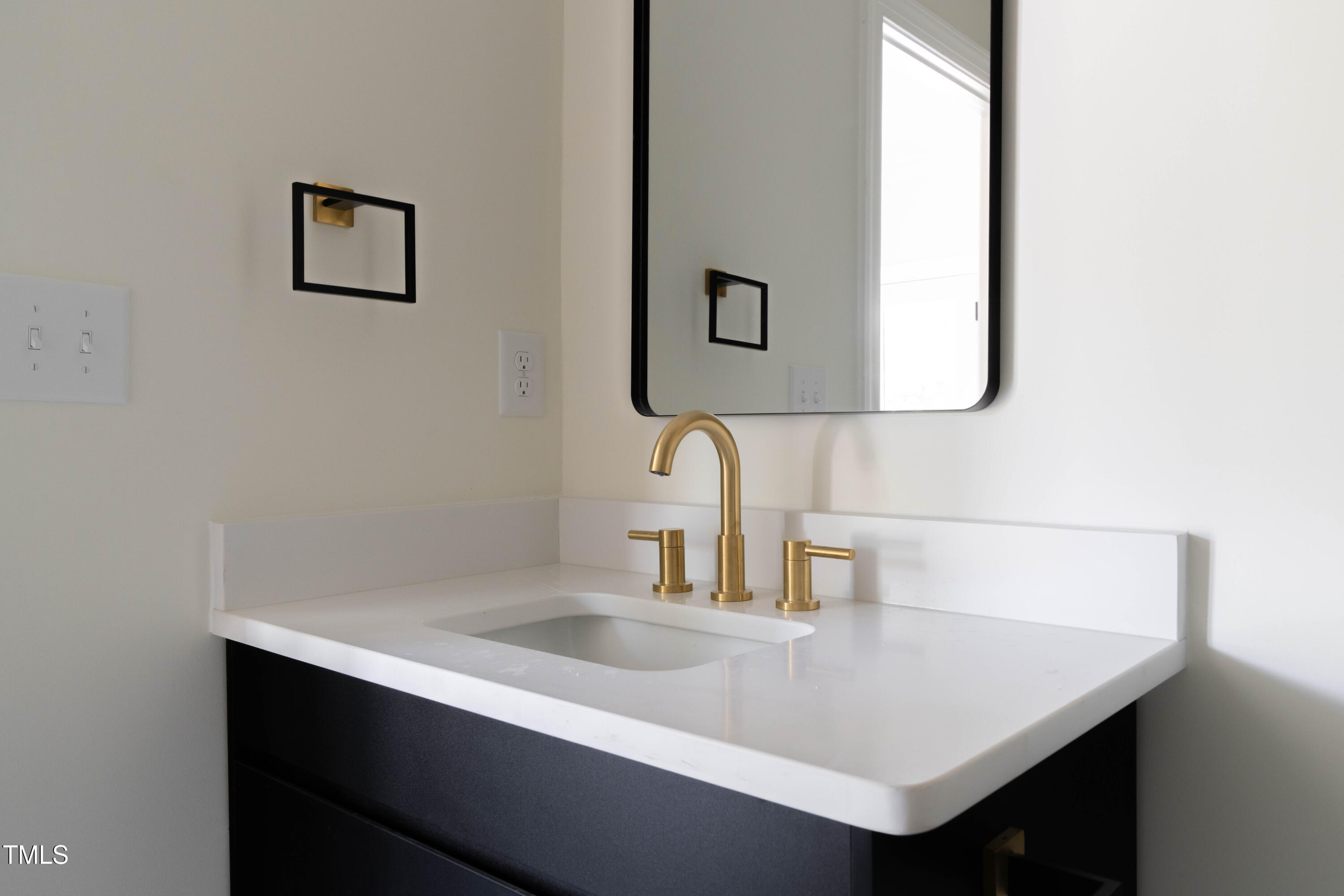 1124 Upchurch Street Raleigh, NC 27610 - Photo 36 of 45 a bathroom with a sink and a mirror