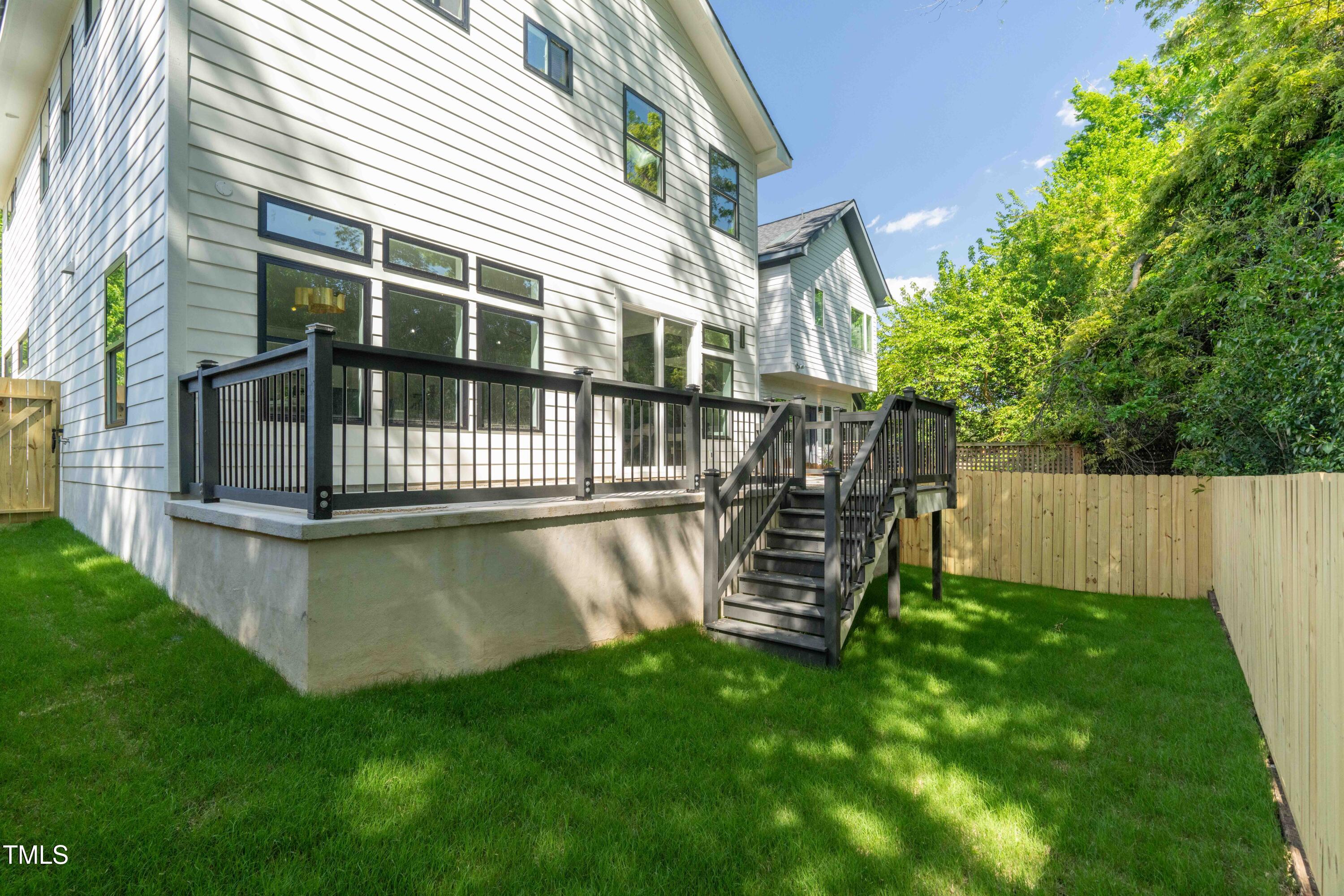 1124 Upchurch Street Raleigh, NC 27610 - Photo 45 of 45 a view of a house with a yard and deck