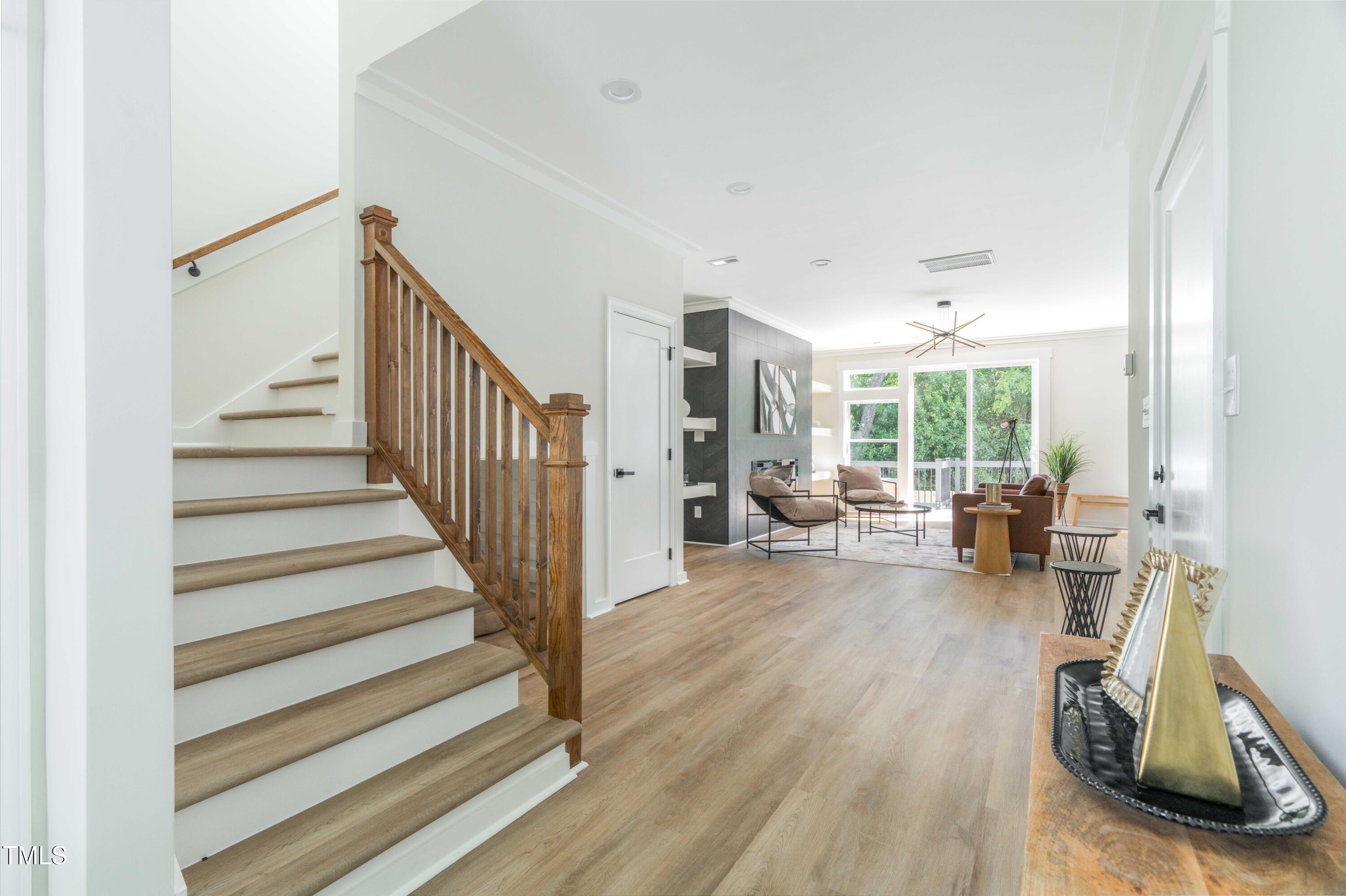 1124 Upchurch Street Raleigh, NC 27610 - Photo 5 of 45 a view of a livingroom with wooden floor and furniture