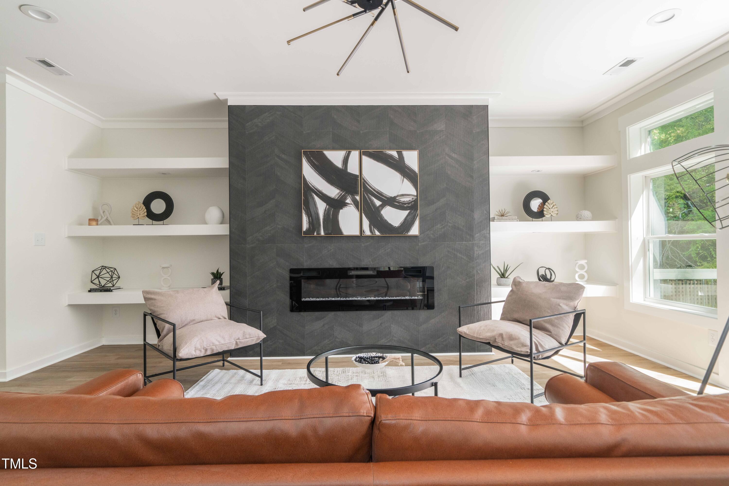 1124 Upchurch Street Raleigh, NC 27610 - Photo 8 of 45 a living room with furniture and a fireplace