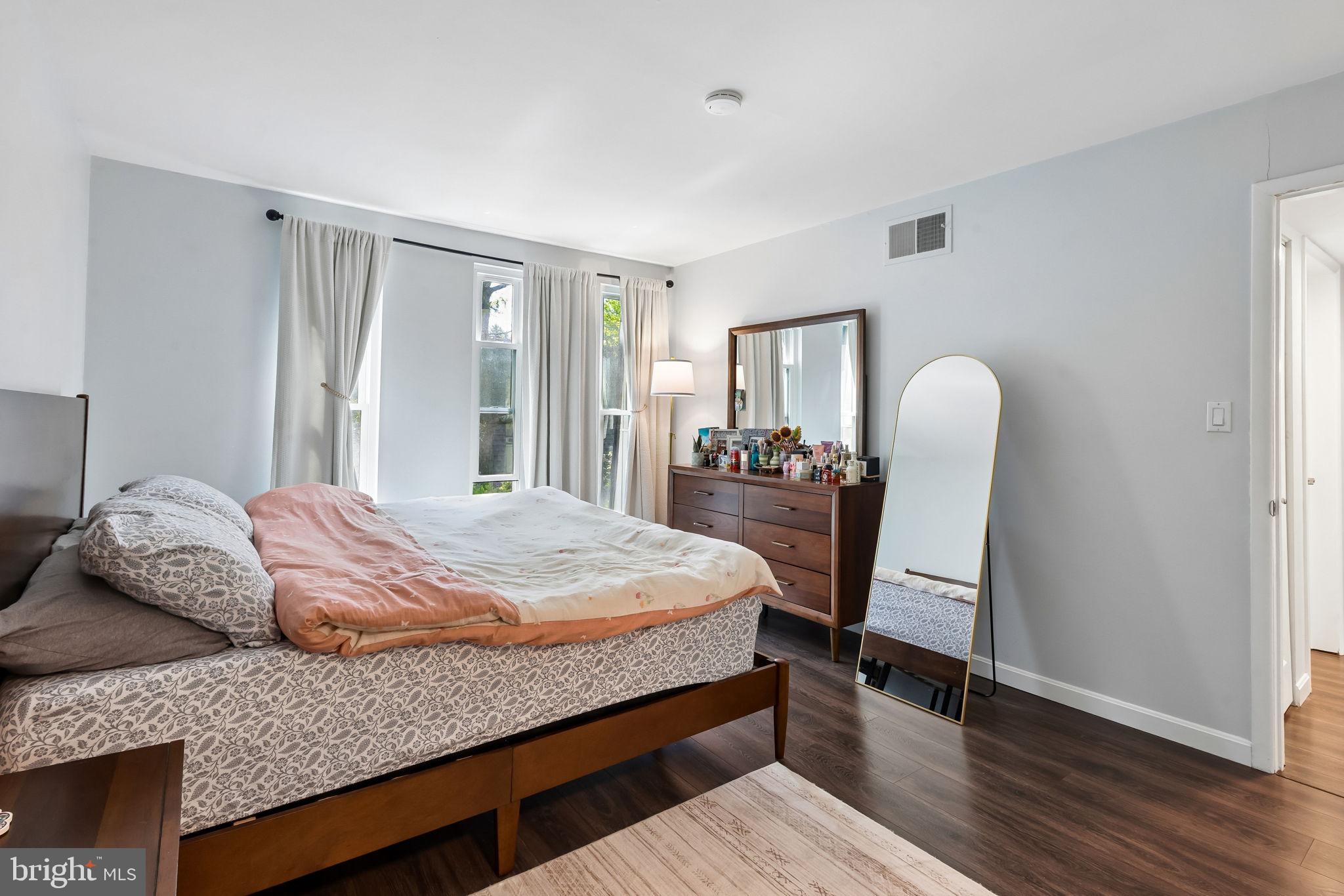 25 South Church Road, Unit 56 Maple Shade, NJ 08052 - Photo 20 of 26 a bedroom with a bed and wooden floor