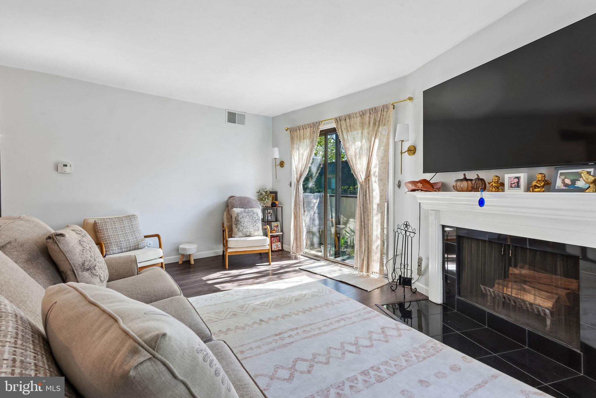 25 South Church Road, Unit 56 Maple Shade, NJ 08052 - Photo 3 of 26 a bedroom with furniture and a fireplace
