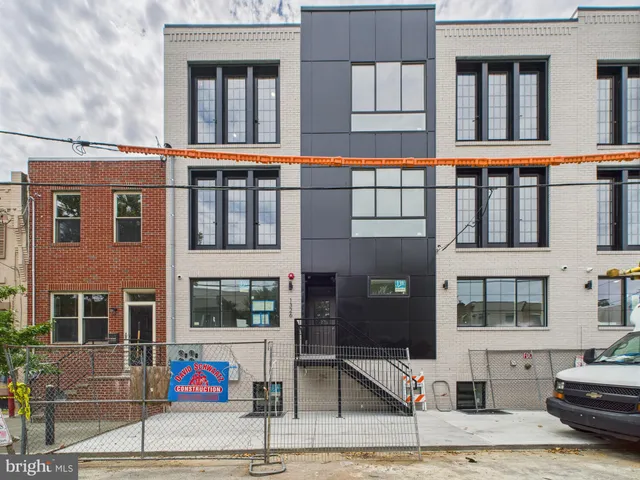a front view of a building with glass windows