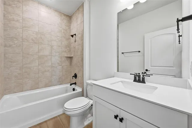 a bathroom with a sink a toilet and a bathtub