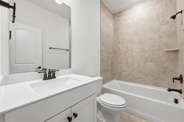 a bathroom with a sink a toilet and a bathtub