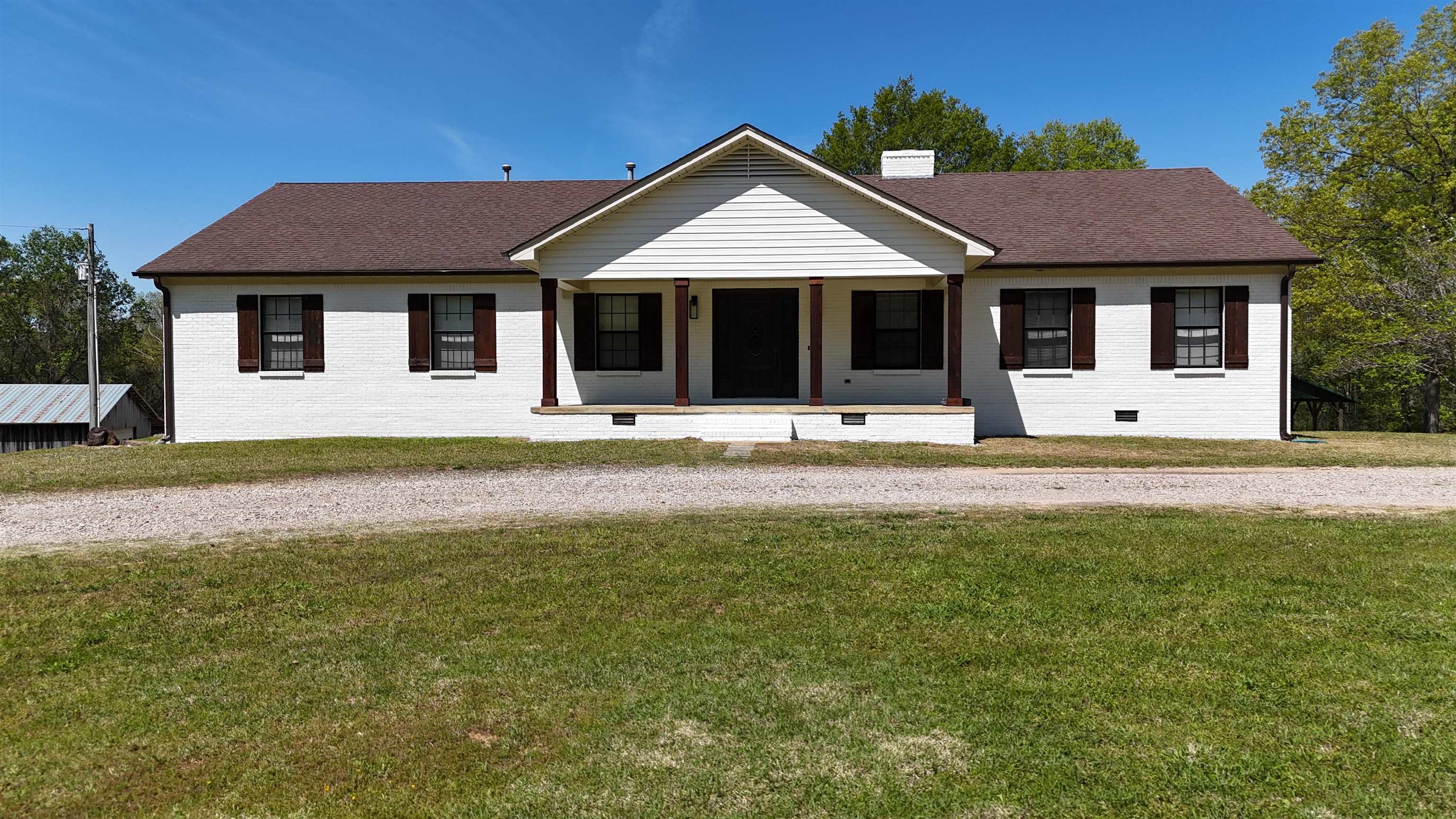 3360 Ebenezer Road Toone, TN 38381 - Photo 2 of 40 a front view of a house with a yard