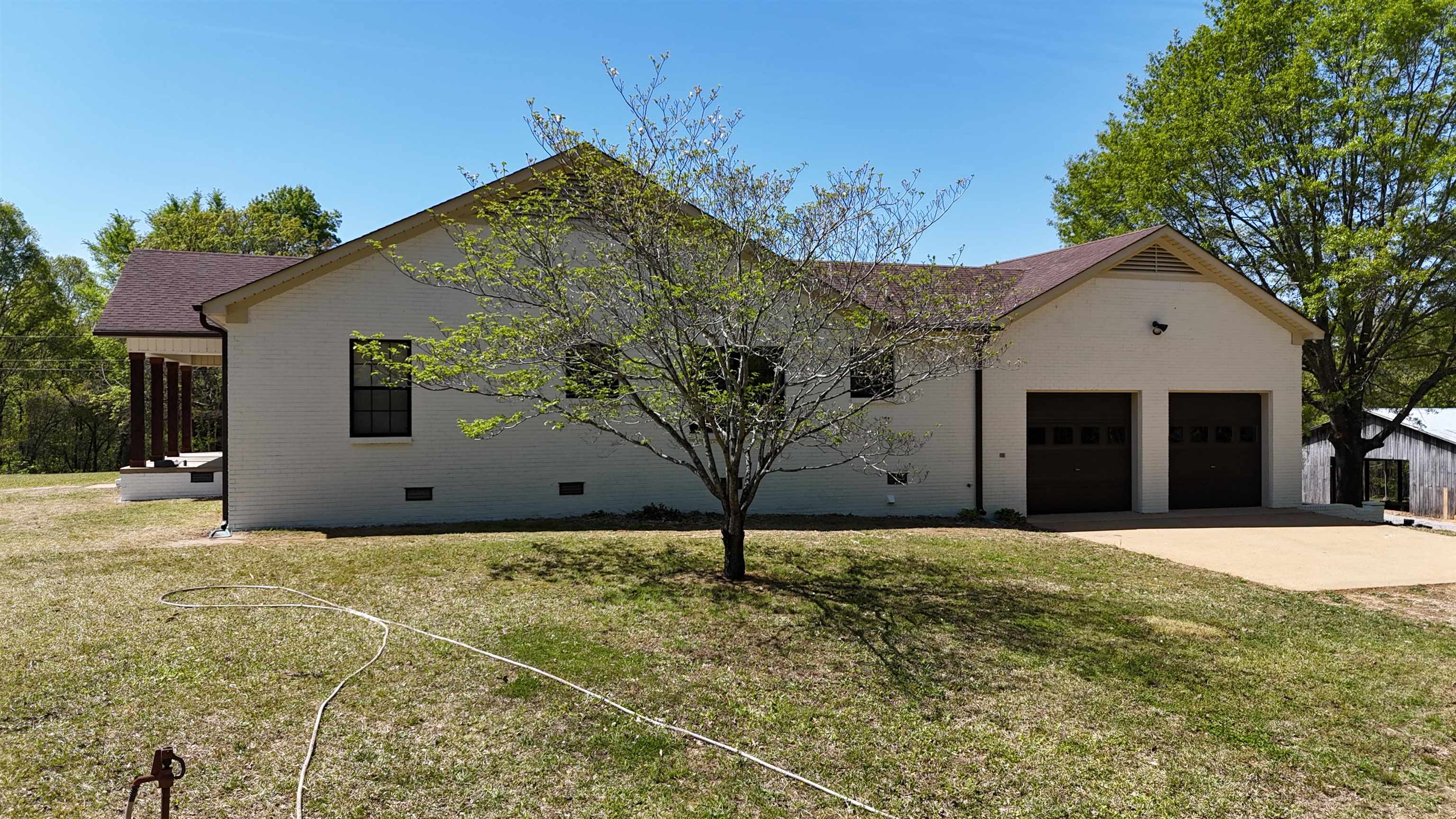3360 Ebenezer Road Toone, TN 38381 - Photo 4 of 40 a house with yard in front of it