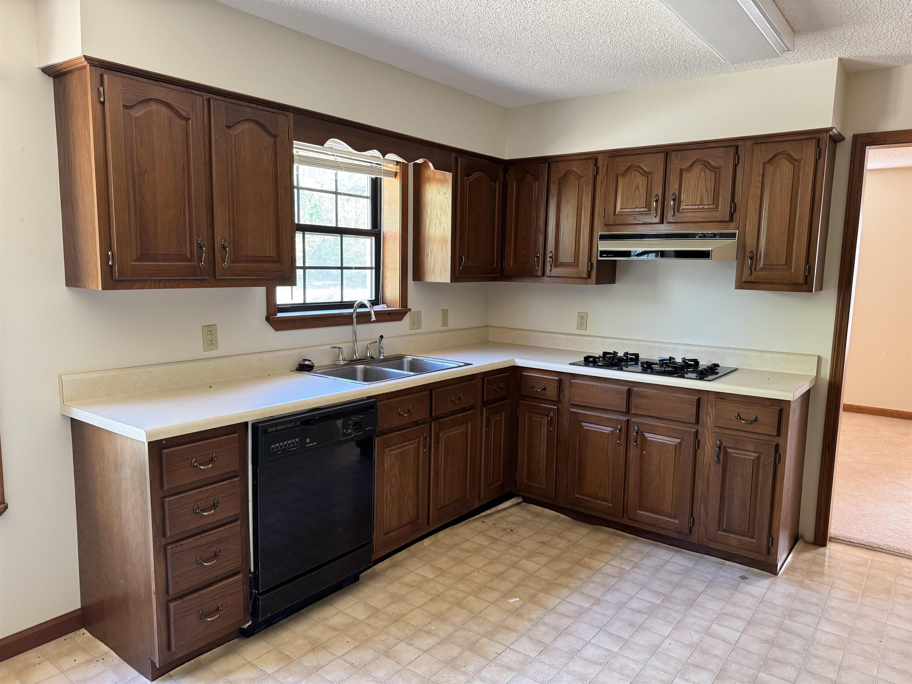 3360 Ebenezer Road Toone, TN 38381 - Photo 7 of 40 a kitchen with sink cabinets and window
