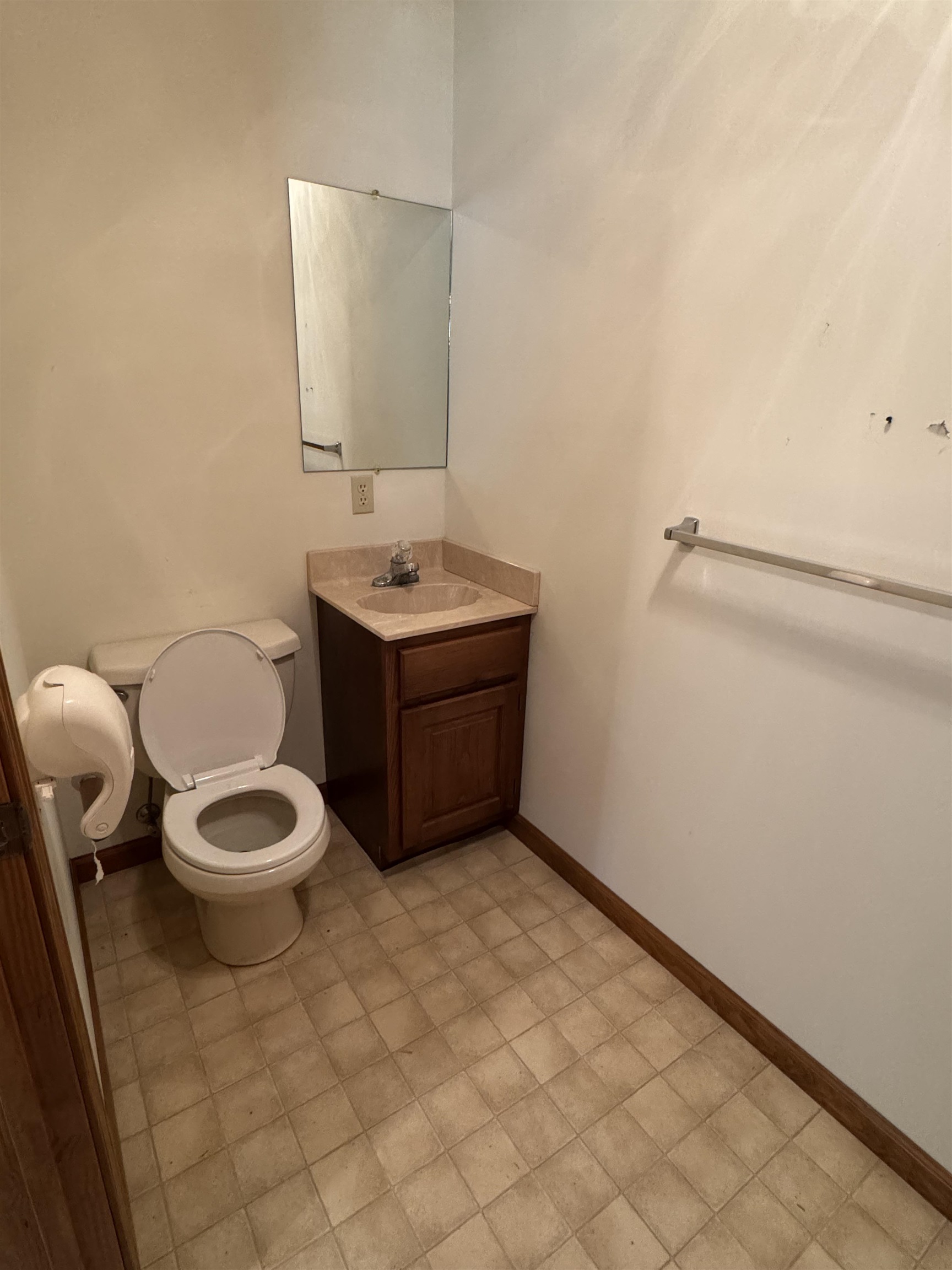 3360 Ebenezer Road Toone, TN 38381 - Photo 10 of 40 a bathroom with a toilet a sink and mirror