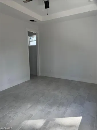 a view of an empty room and window