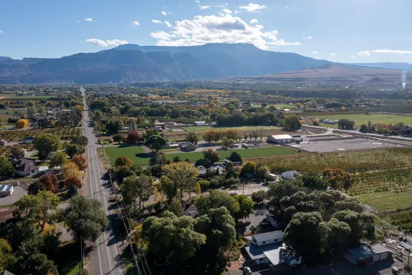 an aerial view of residential houses and outdoor space