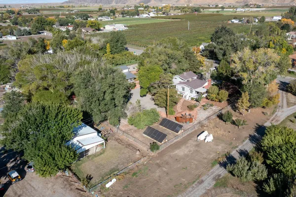 an aerial view of a house with a lake view