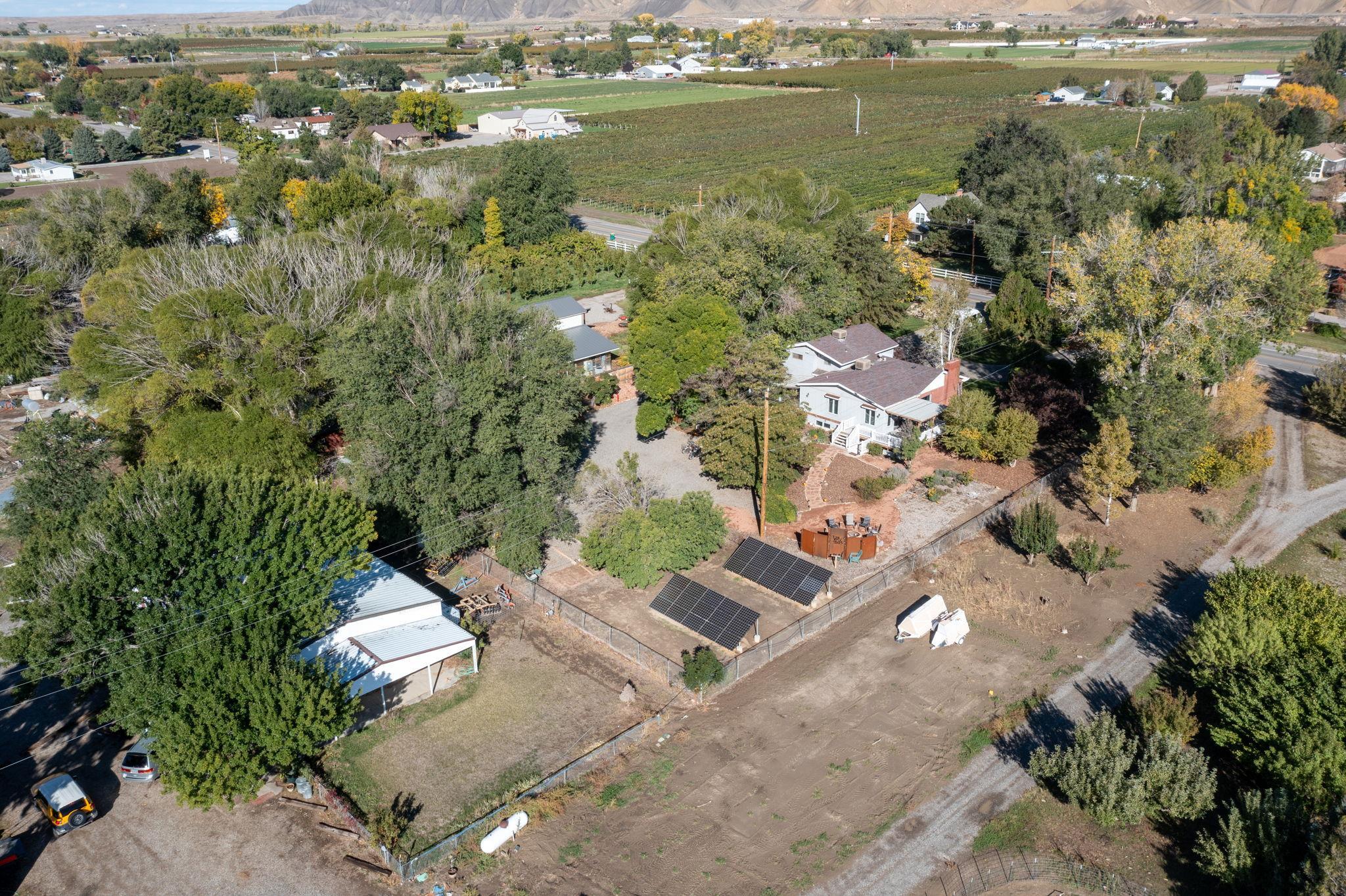 3587 G Road Palisade, CO 81526 - Photo 13 of 42 an aerial view of a house with a lake view