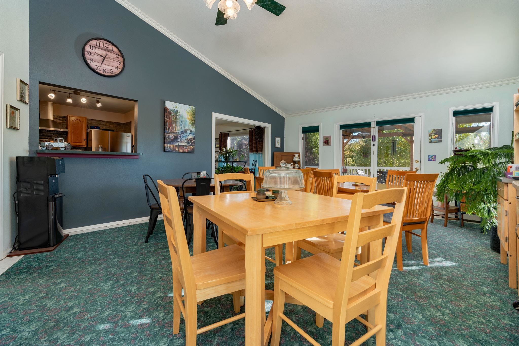 3587 G Road Palisade, CO 81526 - Photo 19 of 42 a view of a dining room with furniture and a chandelier