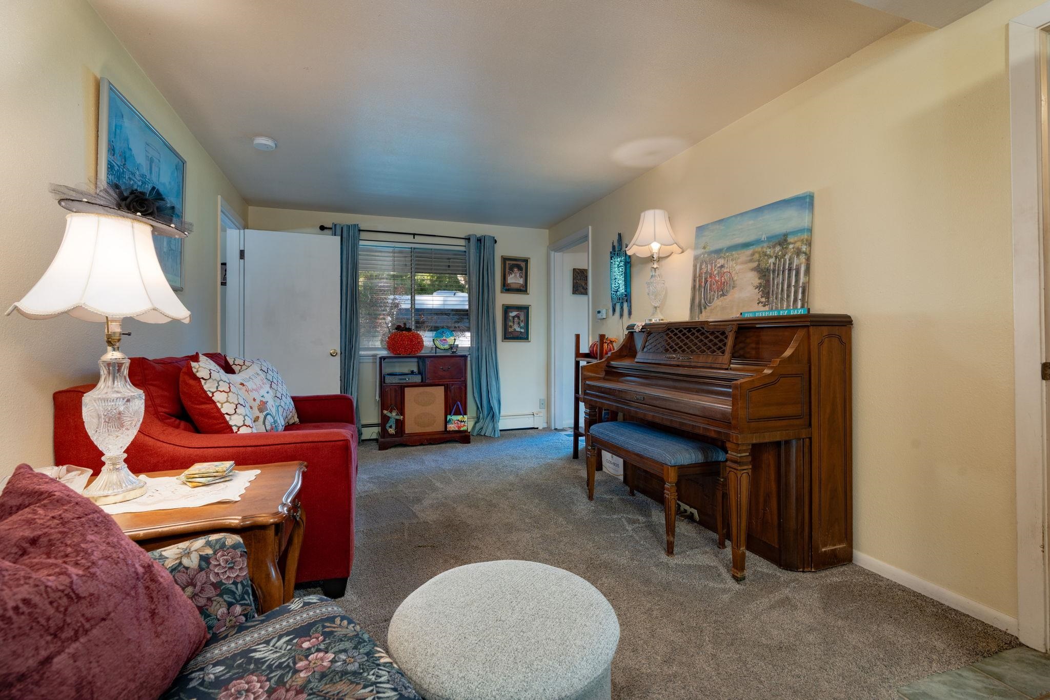 3587 G Road Palisade, CO 81526 - Photo 24 of 42 a living room with furniture and a lamp