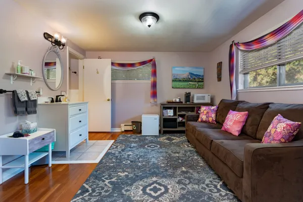 a living room with furniture and a window