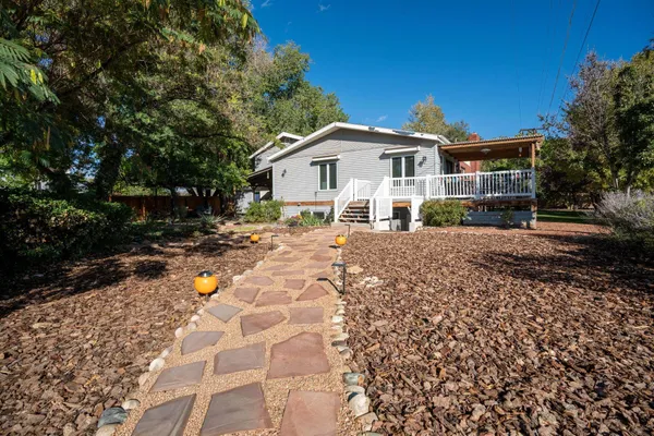 a view of a house with a yard
