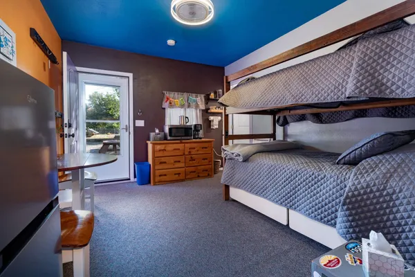 a bedroom with furniture and a window