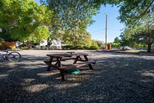 a view of a backyard with sitting area