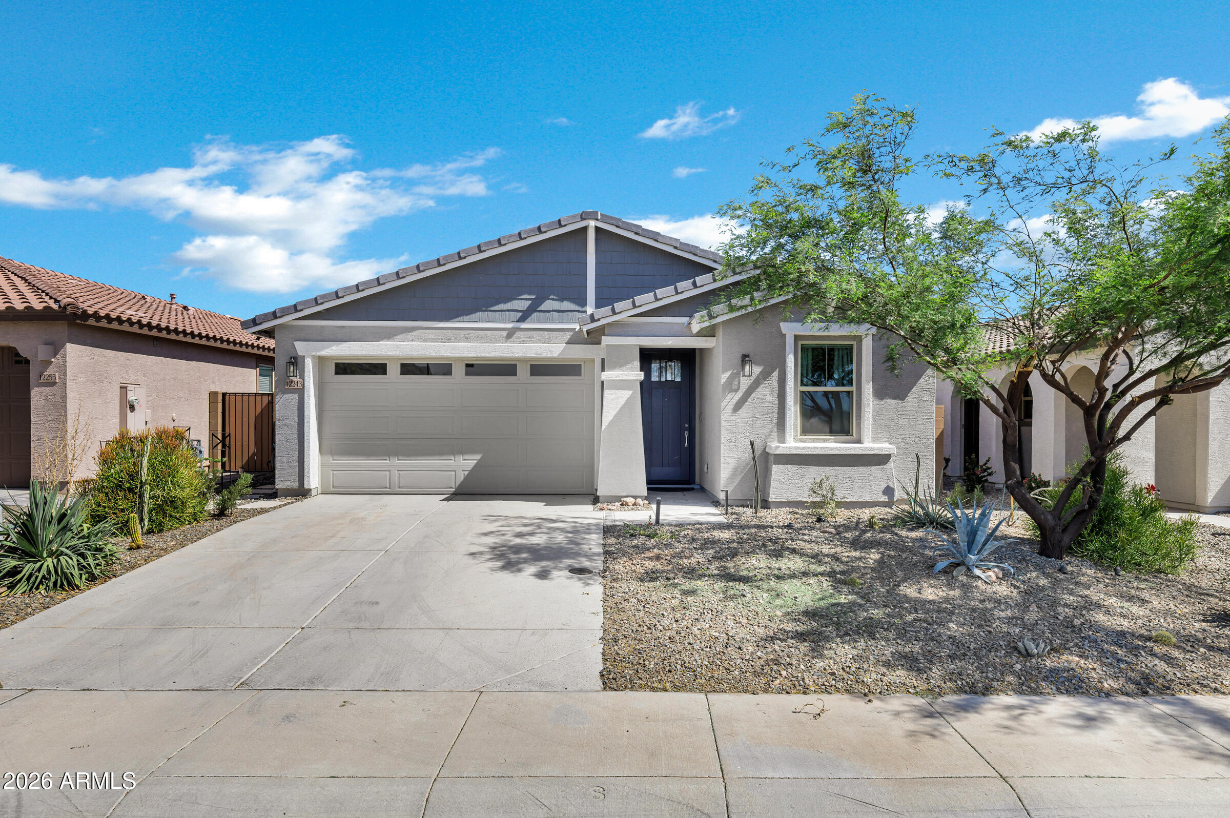12243 East Sereno Road Gold Canyon, AZ 85118 - Photo 2 of 37 a front view of a house with plants