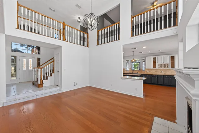 a view of a room with wooden floor