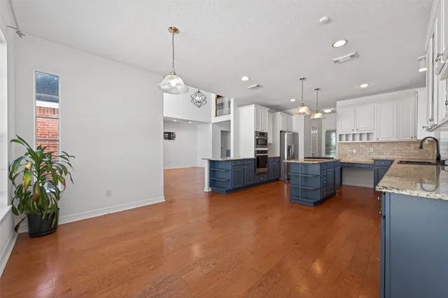 a view of a room with wooden floor and closet