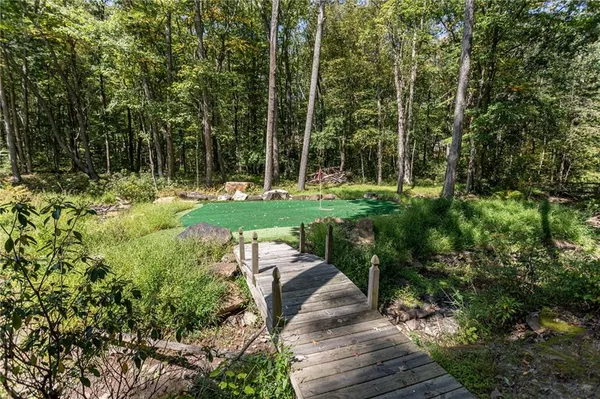 a view of a backyard with sitting area