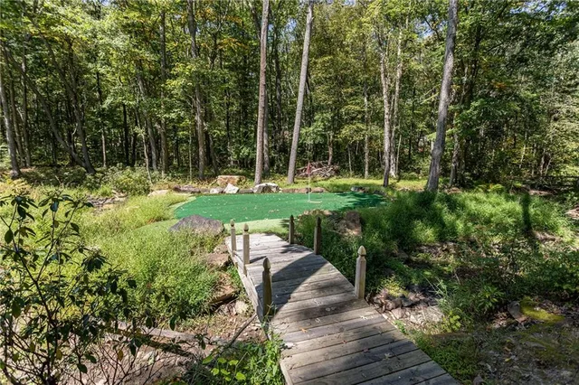 a view of a backyard with sitting area
