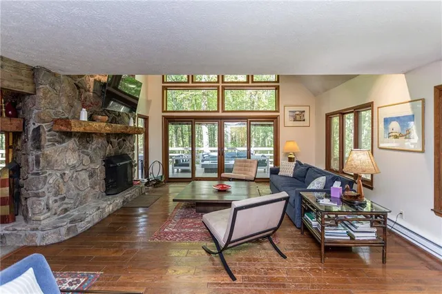 a living room with fireplace furniture and a fireplace