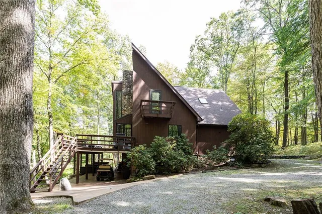 front view of a house with a tree