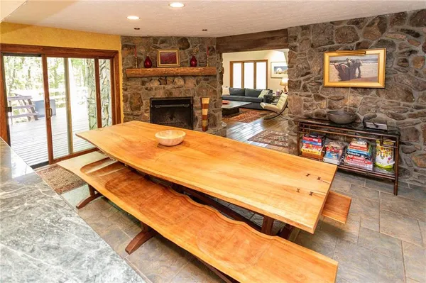 a living room with furniture pool table and flat screen tv