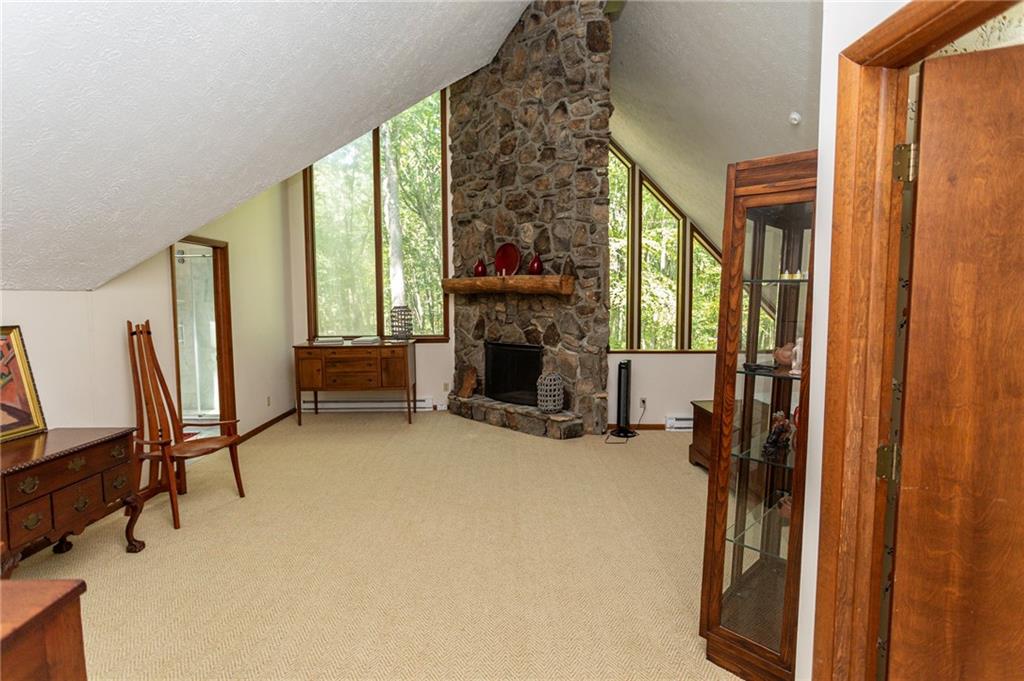 255 Smith School Road Farmington, PA 15437 - Photo 29 of 50 a view of a livingroom with furniture and a fireplace