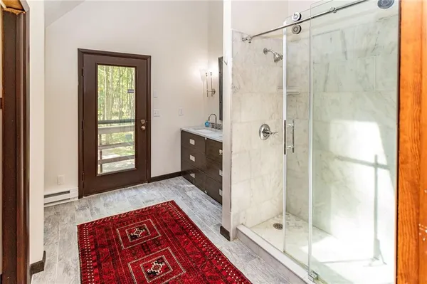 a bathroom with a double vanity sink and mirror