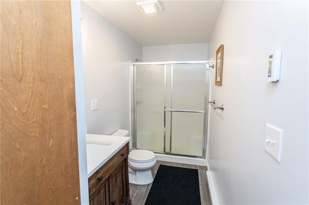 255 Smith School Road Farmington, PA 15437 - Photo 40 of 50 a bathroom with a granite countertop bathtub shower sink vanity and toilet