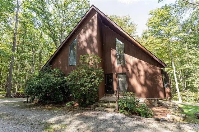 a view of barn with a small yard