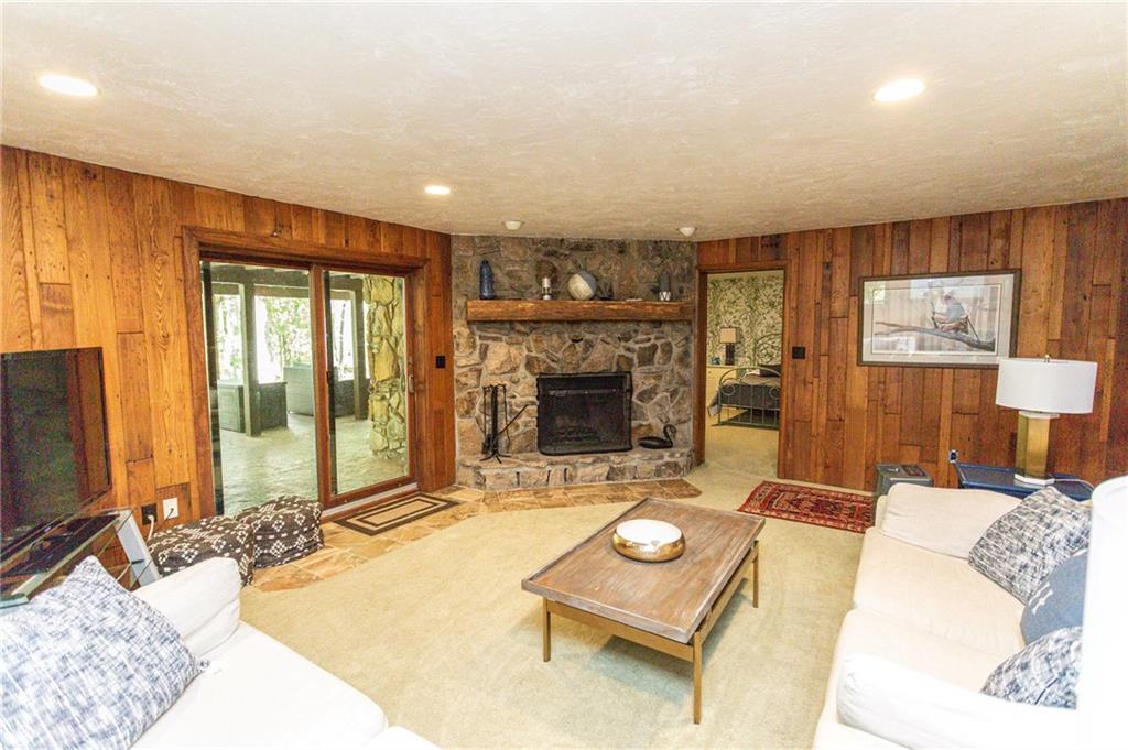 255 Smith School Road Farmington, PA 15437 - Photo 42 of 50 a living room with fireplace furniture and a flat screen tv