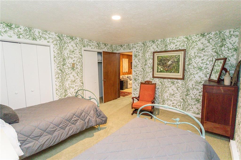 255 Smith School Road Farmington, PA 15437 - Photo 44 of 50 a bedroom with a bed and furniture