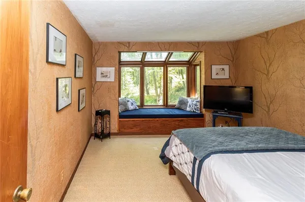 a dining room with furniture window and wooden floor