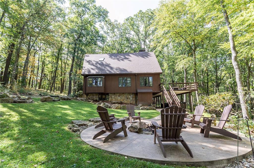 255 Smith School Road Farmington, PA 15437 - Photo 6 of 50 a view of a house with backyard porch and sitting area