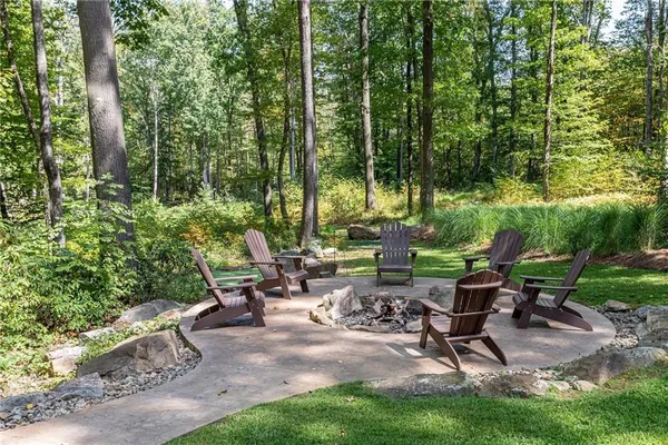 a view of an outdoor sitting area with fire pit