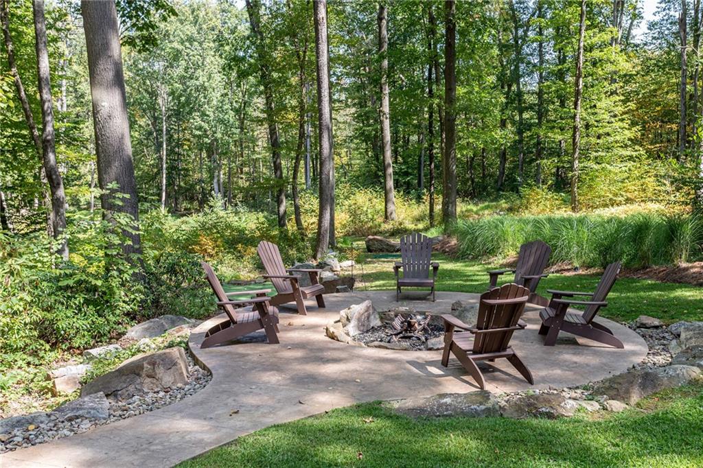 255 Smith School Road Farmington, PA 15437 - Photo 7 of 50 a view of an outdoor sitting area with fire pit