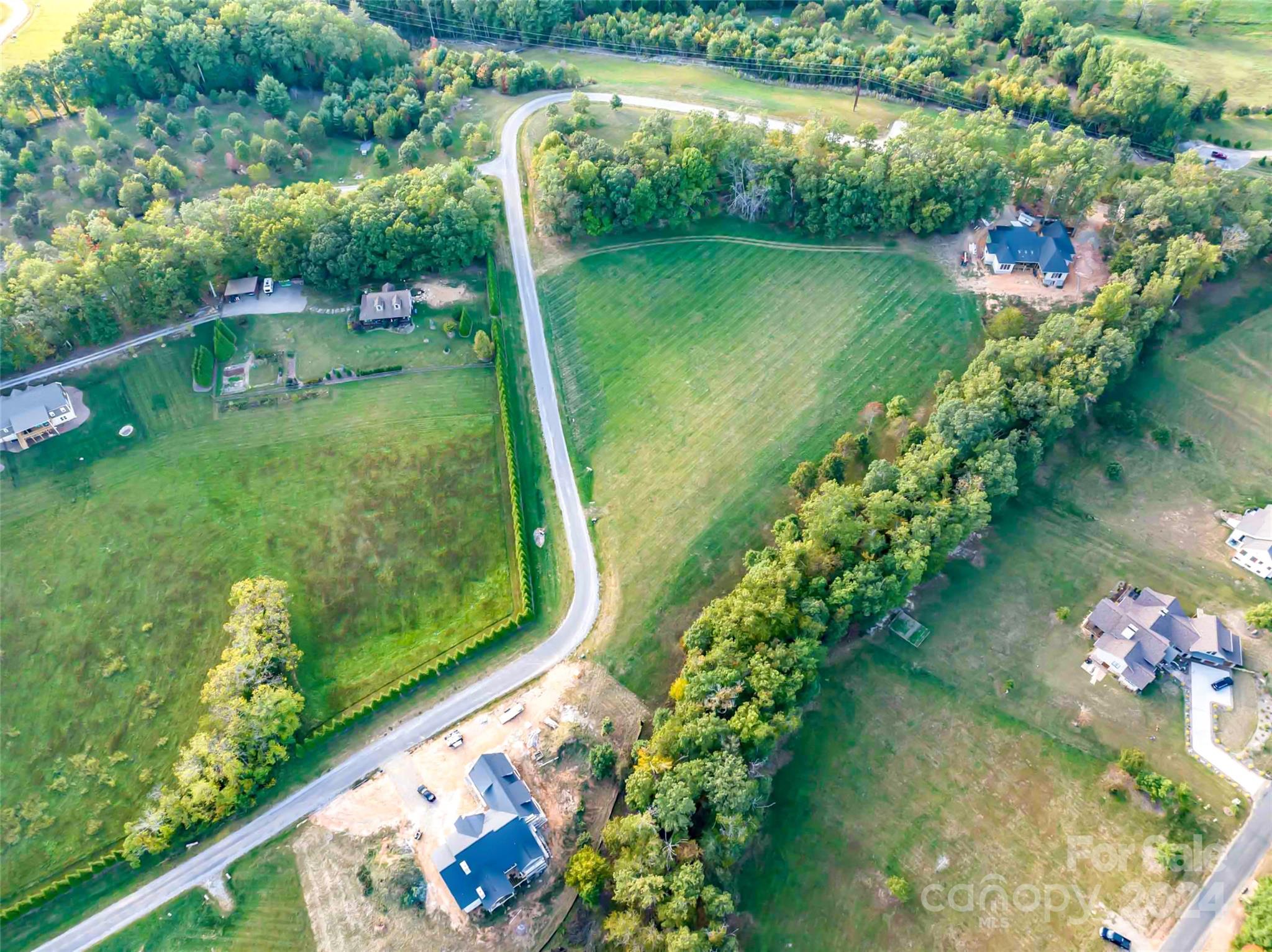 365 Chukar Way, Unit LOT 22 Fletcher, NC 28732 - Photo 11 of 12 a view of a lake with a yard
