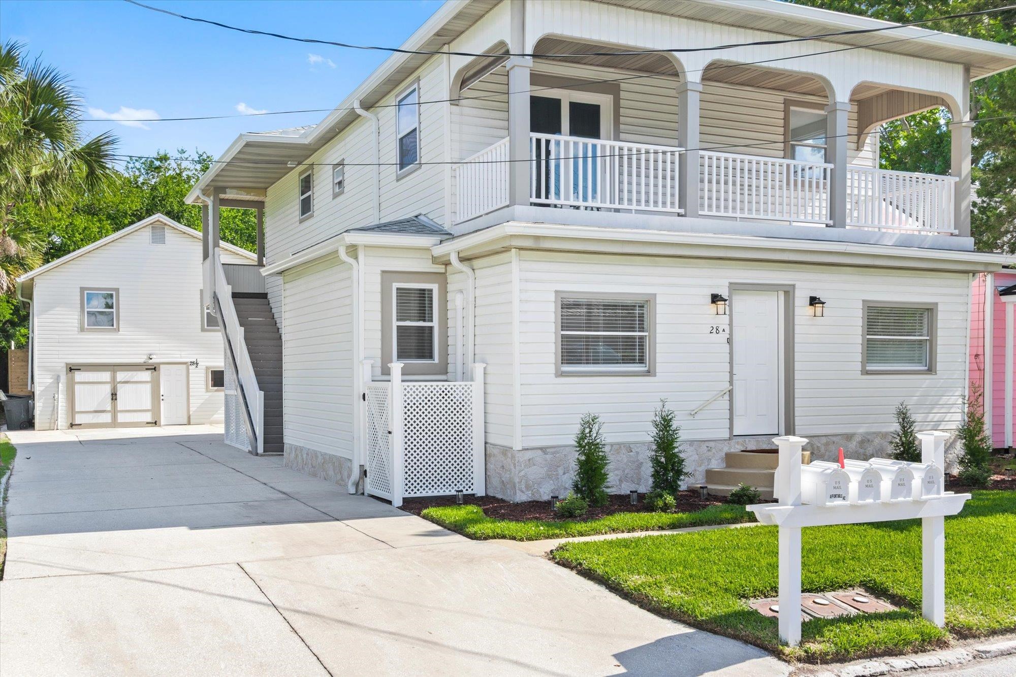 28 Sebastian Avenue, Unit A St. Augustine, FL 32084 - Photo 2 of 26 a front view of a house with garden