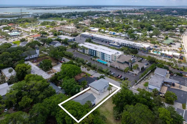 an aerial view of residential houses with outdoor space